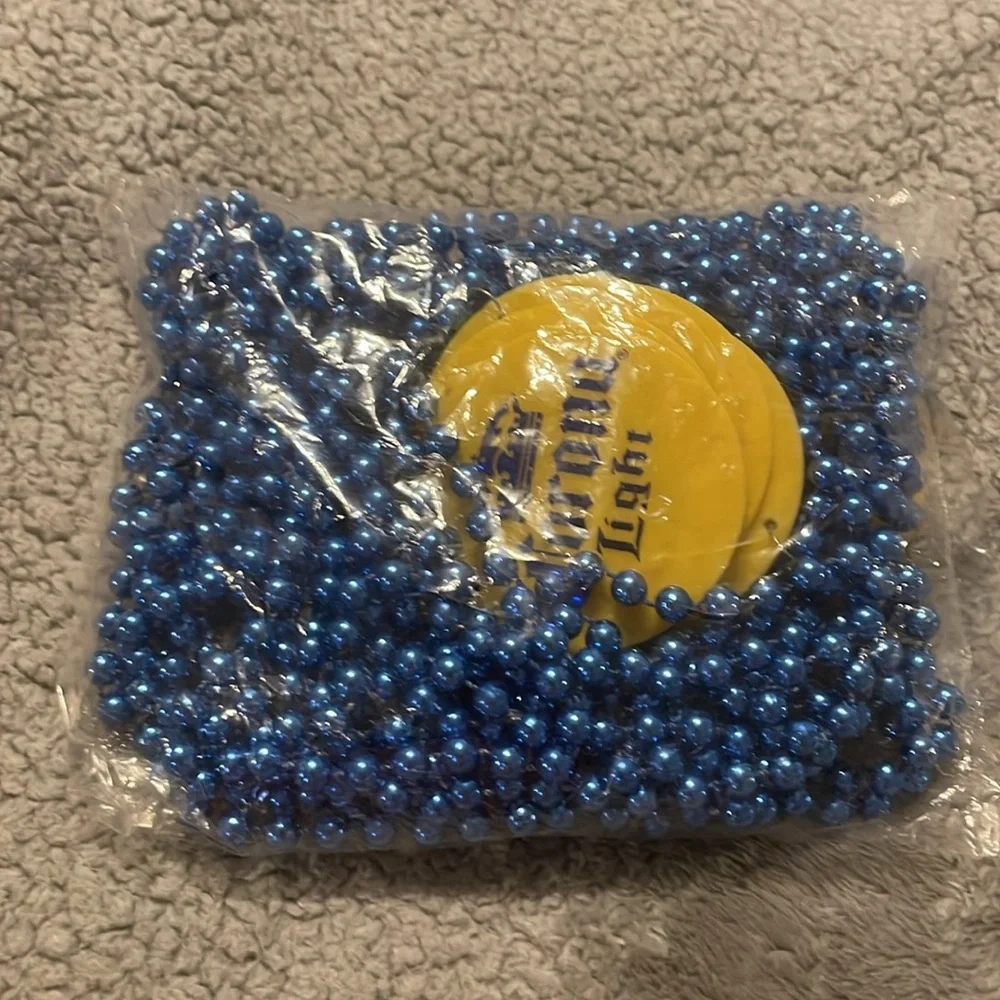 12 Corona Light Yellow Coasters with Blue Beads necklace